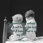 Two small children kneel at their bedside to say bedtime prayers. Psalms 56:9: My enemies will retreat when I call to you for help. This I know: God is on my side!”
