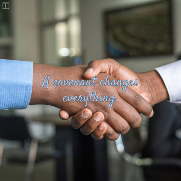 hotograph of two people shaking hands indoors, symbolizing agreement or partnership. Text overlay in blue cursive font reads "A covenant changes everything,"