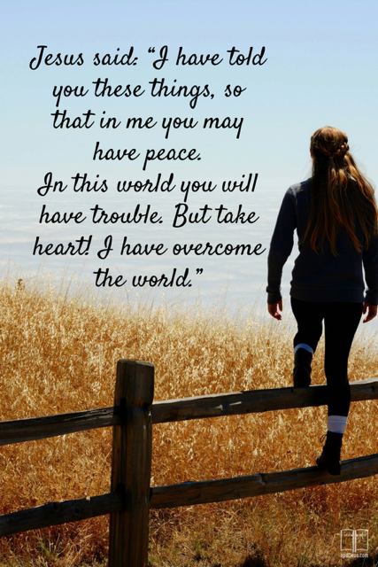 A young woman stands on a farm fence examining the land. Jesus said that in this world we would have problems, but He overcame the world.
