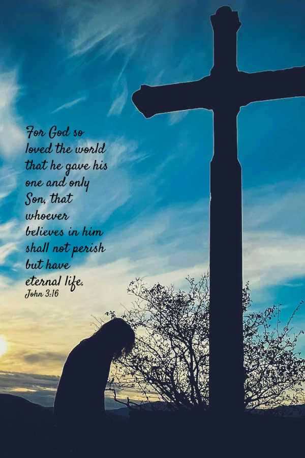 Photograph shows a silhouetted person kneeling beside a large cross against a blue-and-gold sunset sky. Text quotes John 3:16: For God so loved the world that He gave his one and only Son that whoever believes in him shall not perish but have eternal life.