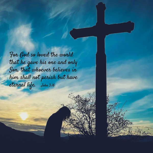 Photograph shows a silhouetted person kneeling beside a large cross against a blue-and-gold sunset sky. Text quotes John 3:16: For God so loved the world that He gave his one and only Son that whoever believes in him shall not perish but have eternal life.