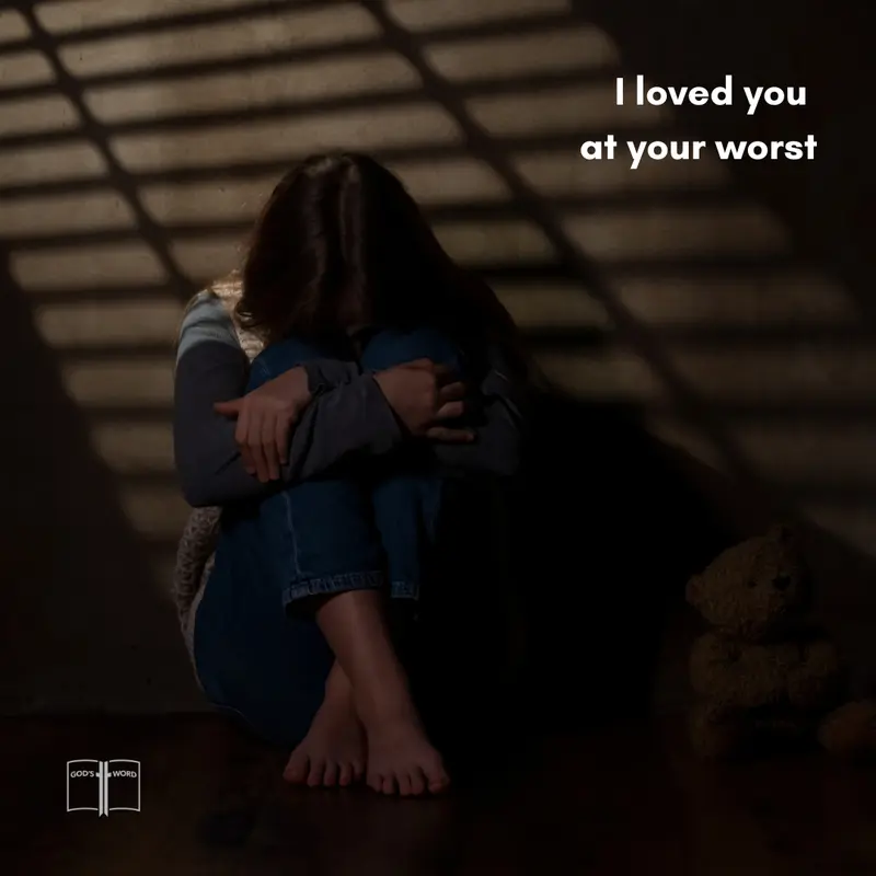 Loved You at Your Worst Person sitting in darkness with message “I loved you at your worst,” symbolizing God’s grace.